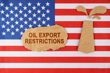 On the US flag there is an oil rig cut out of cardboard and a sign with the inscription - oil export restrictions