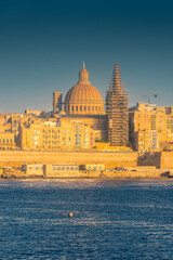 Fototapeta na wymiar Skyline of Valletta at sunset, view from Sliema, Malta