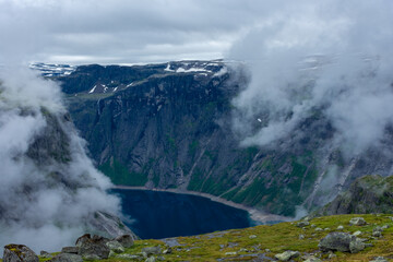 Moody foggy landscape in the mountains of Trolltunga,  Norway