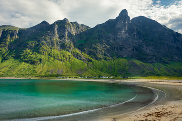 The crystal clear water of the Ersfjordstranda beach in Senja Island,  Norway