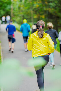 Blurred Background Of Unrecognizable Young Runners At Cross Country Race, Sport Concept