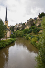 Fototapeta na wymiar Église Saint-Jean-du-Grund Church, Alzette River, and Cityscape Panorama of Old Town, Luxembourg