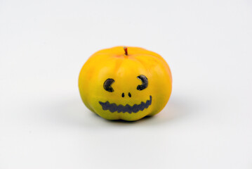 Halloween pumpkin decor with funny faces on a white background with space for text