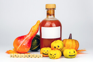 Halloween decor with pumpkins, blood, lantern and candles on a white background with space for text