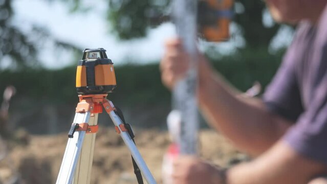 Laser measurement process during build a new road or highway, construction tools and equipment concept