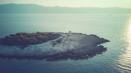 Early morning aerial image of cape Raznjic lighthouse on the rocky shore of Korcula island, Croatia