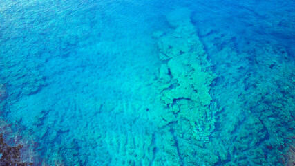 Aerial image of amazing submerged rocks near the sea surface at the Korcula island, Croatia, perfect for diving