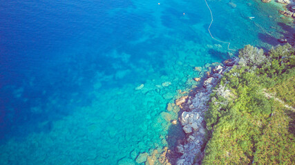 Naklejka na ściany i meble Aerial view of fallen off rocks on the Mokalo beach near the town of Orebic, Croatia