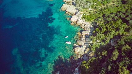 Naklejka na ściany i meble Aerial view of amazing shoreline at the Mokalo beach near town of Orebic on Peljesac peninsula, Croatia, with large stone rocks partially submerged in turquise sea water