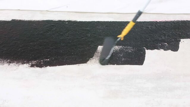 Water proofing concept of the concrete or foundation of the new house, hydro isolation of the concrete, industrial concept