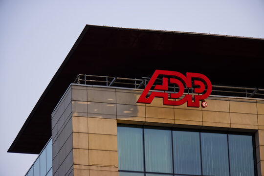 ADP (Automatic Data Processing) signage, logo, emblem on the facade of an American provider of human resources management software and services. Warsaw, Poland, September 8, 2023