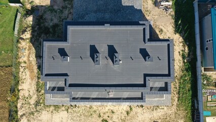  Contemporary architecture of private housing. Flat roof, rectangular cottage. Aerial view from a...