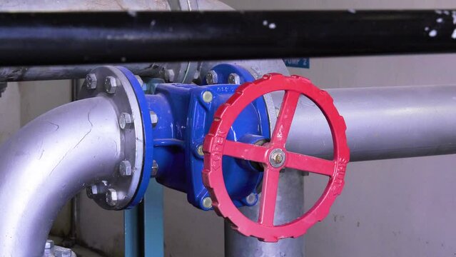 indoors station pumping water, pipes and gauges
