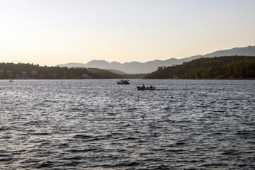 Boats returning to the port in the small town of Lumbarda on Korcula island, Croatia, during sunset