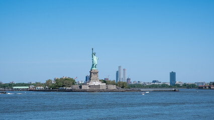 Fototapeta premium View of the Statue of Liberty, a colossal neoclassical sculpture on Liberty Island in New York Harbor in New York City, in the United States.