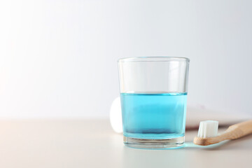 A mouthwash on a colored background. Dental care, dental health.