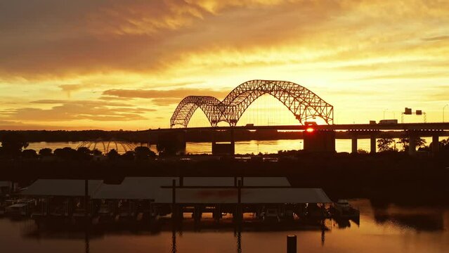 Fly over of bridge over the Mississippi river in Memphis at sunset