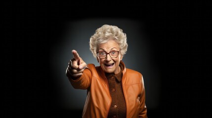 senior woman pointing isolated on background