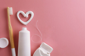 Toothpaste heart on a colored background. Dental care, oral health.