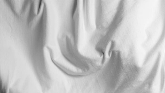 White fabric blowing in slow motion