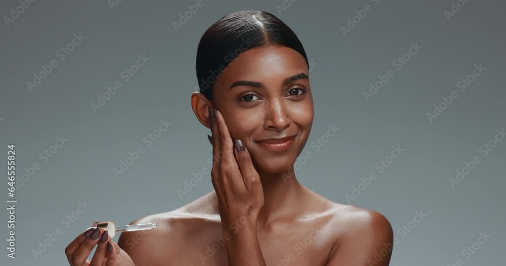 Poster Woman, serum and drop on face, studio or shine for health, wellness and skincare by dark background. Girl, model and cosmetics with beauty, transformation and oil with facial aesthetic in portrait