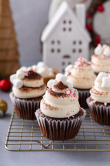 Hot chocolate cupcakes with mini marshmallows, peppermint candy pieces and cocoa