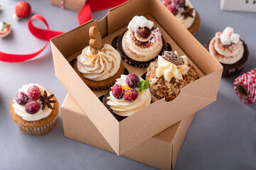 Variety of Christmas cupcakes in a gift box