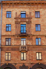 facade of an old brick building in the city center with evening light