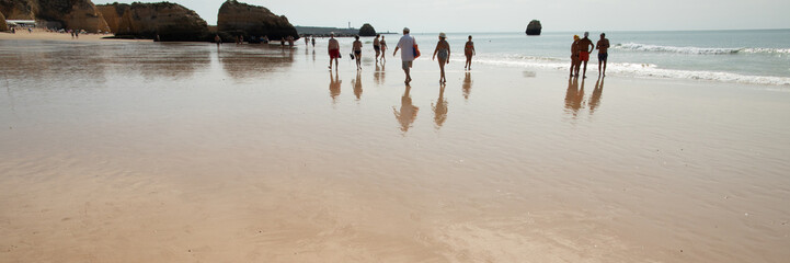 Fototapeta na wymiar public beach in portugal on hot sunny day.