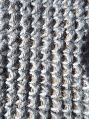 Crocheting of jute, yarn, raffia blue in a circle close-up as a background