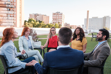 Fototapeta premium Coexistence of a group of co-workers outdoors. Concept: sharing, productivity, business