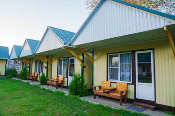 One-story motel houses. Cozy and comfortable accommodation with parking.