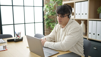 Young hispanic man business worker having online meeting at office