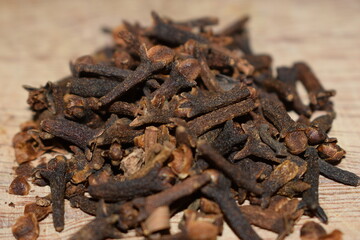 aromatic cloves close-up over a wooden table kitchen