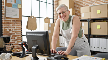 Middle age grey-haired woman ecommerce business worker using computer working at office