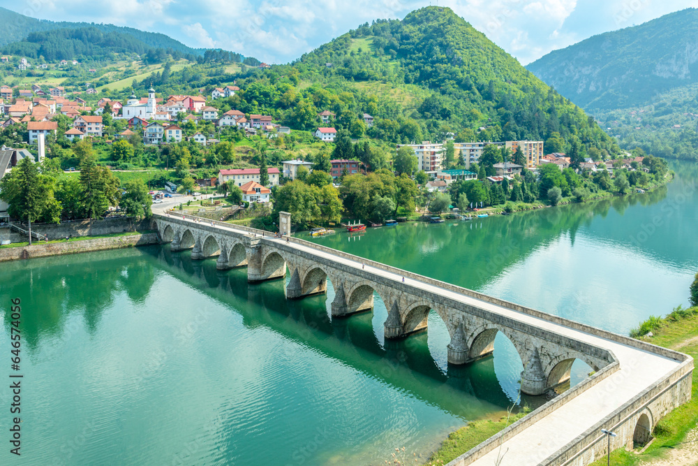 Wall mural mehmed pasa sokolovic bridge over drina river with city panorama, visegrad, bosnia