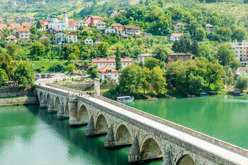 Mehmed Pasa Sokolovic Bridge over Drina river with city panorama, Visegrad, Bosnia