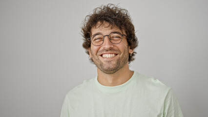 Young hispanic man smiling confident wearing glasses over isolated white background