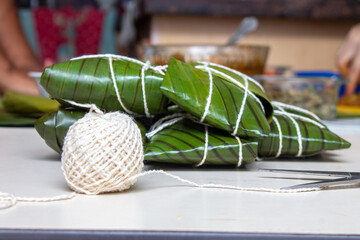 Hallacas or Tamales, typical dish wrapped in banana leaves and different fillings from Latin American countries and the Caribbean