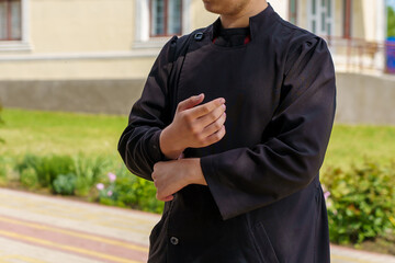 Fototapeta premium Young clergyman. Background with selective focus and copy space