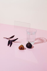 Fresh fig, cup and glass on the table. Close up.