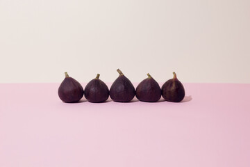 Fresh fig in a row on the table. Close up.