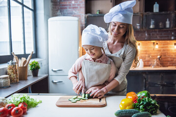 Mother and daughter cooking