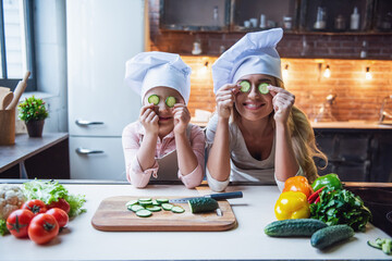 Mother and daughter cooking