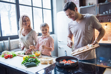 Young family cooking