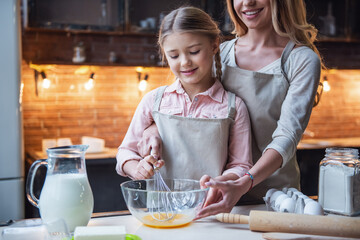 Mother and daughter baking