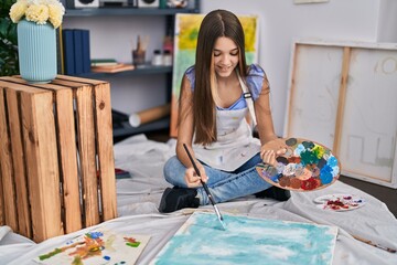 Adorable girl artist smiling confident drawing at art studio