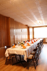 A grand, expansive table adorned with elegant decor and meticulously arranged for a formal gathering.