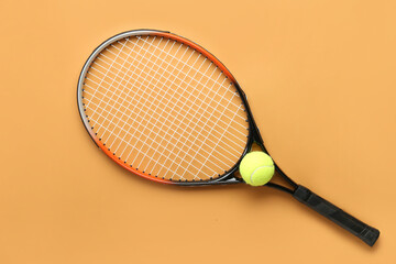 Tennis racket with ball on color background