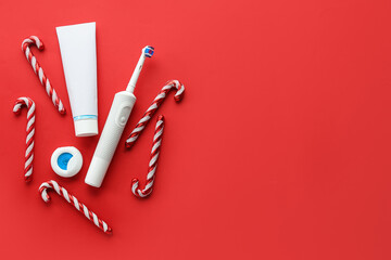Set for oral hygiene with candy canes on red background - obrazy, fototapety, plakaty